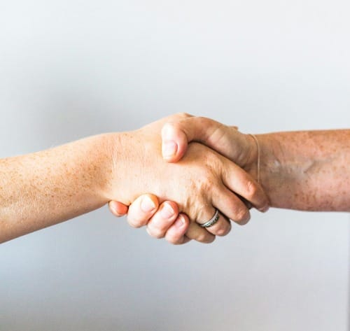 person holding hands of another person